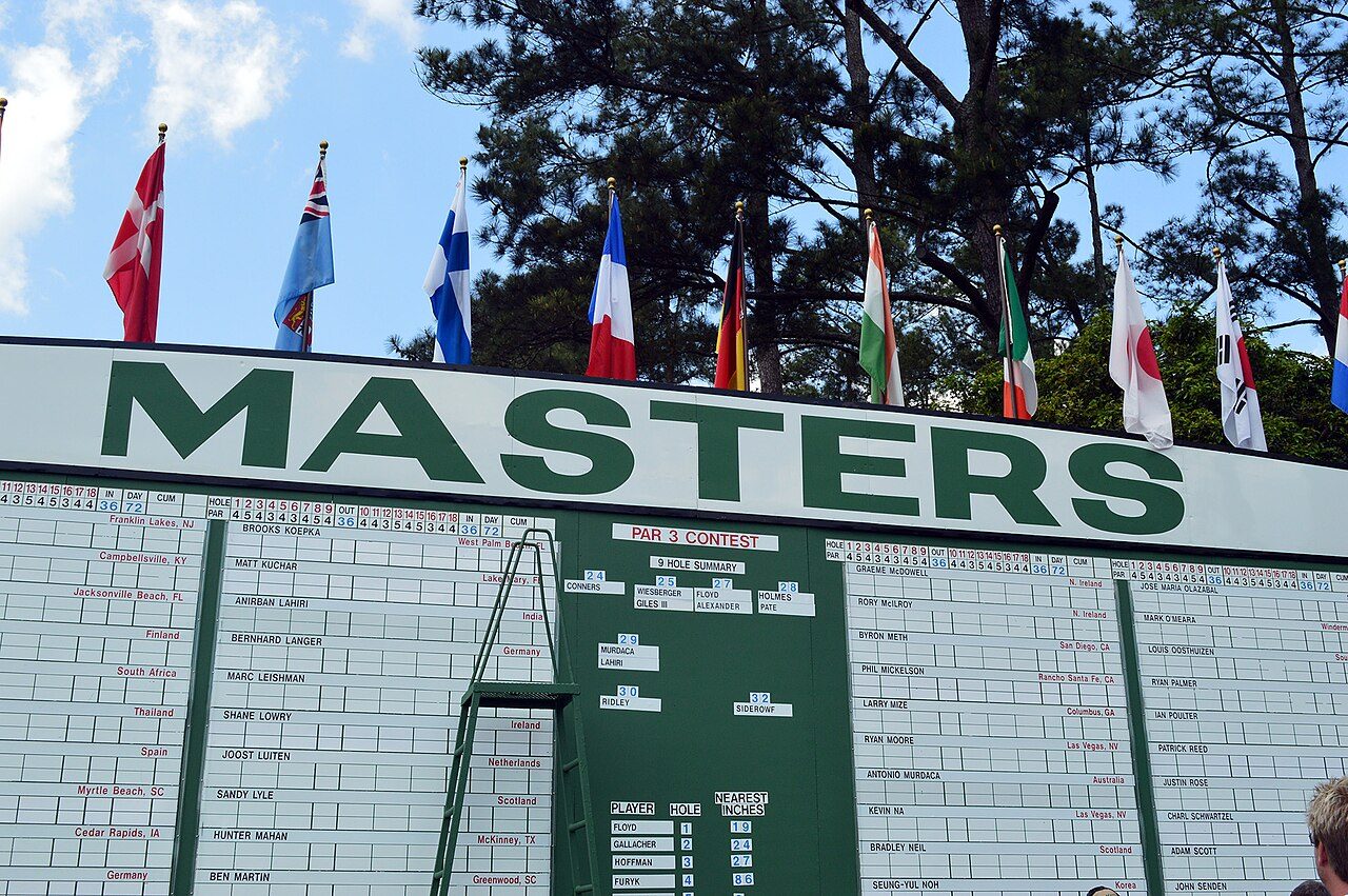 The Masters leaderboard at Augusta National, with international flags flying above it