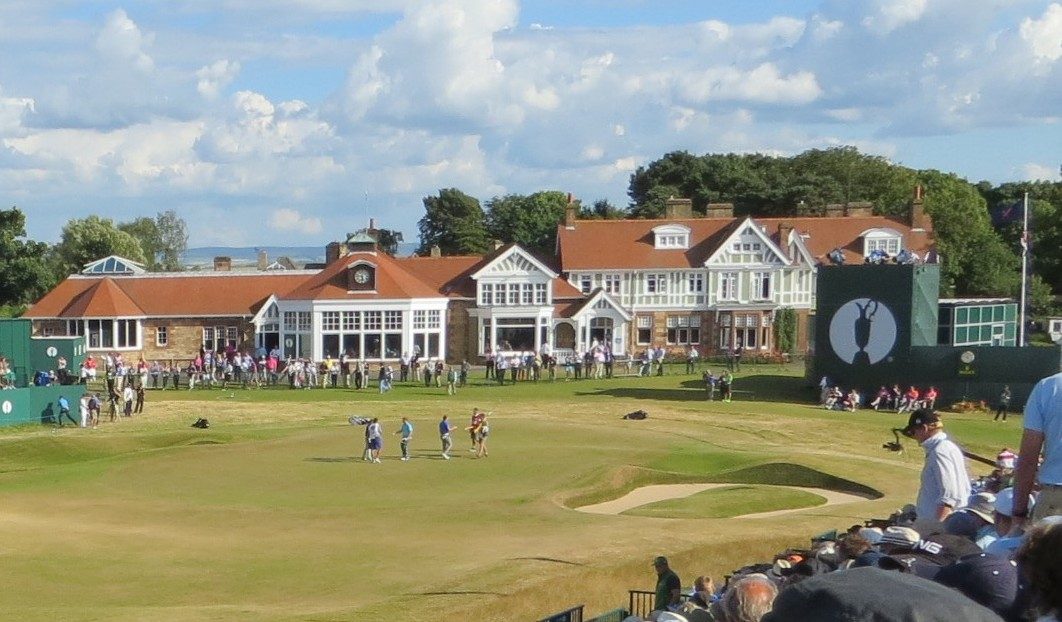 The clubhouse and 18th green at Muirfield in East Lothian, surrounded by grandstands during The Open