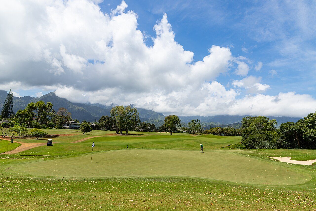 The Makai golf course at Princeville on Kauai's north shore, with mountains and clouds