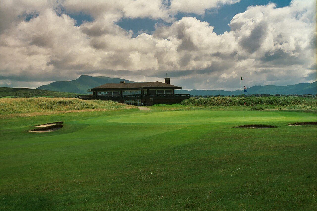 The Waterville Golf Links clubhouse on the Ring of Kerry, with mountains behind