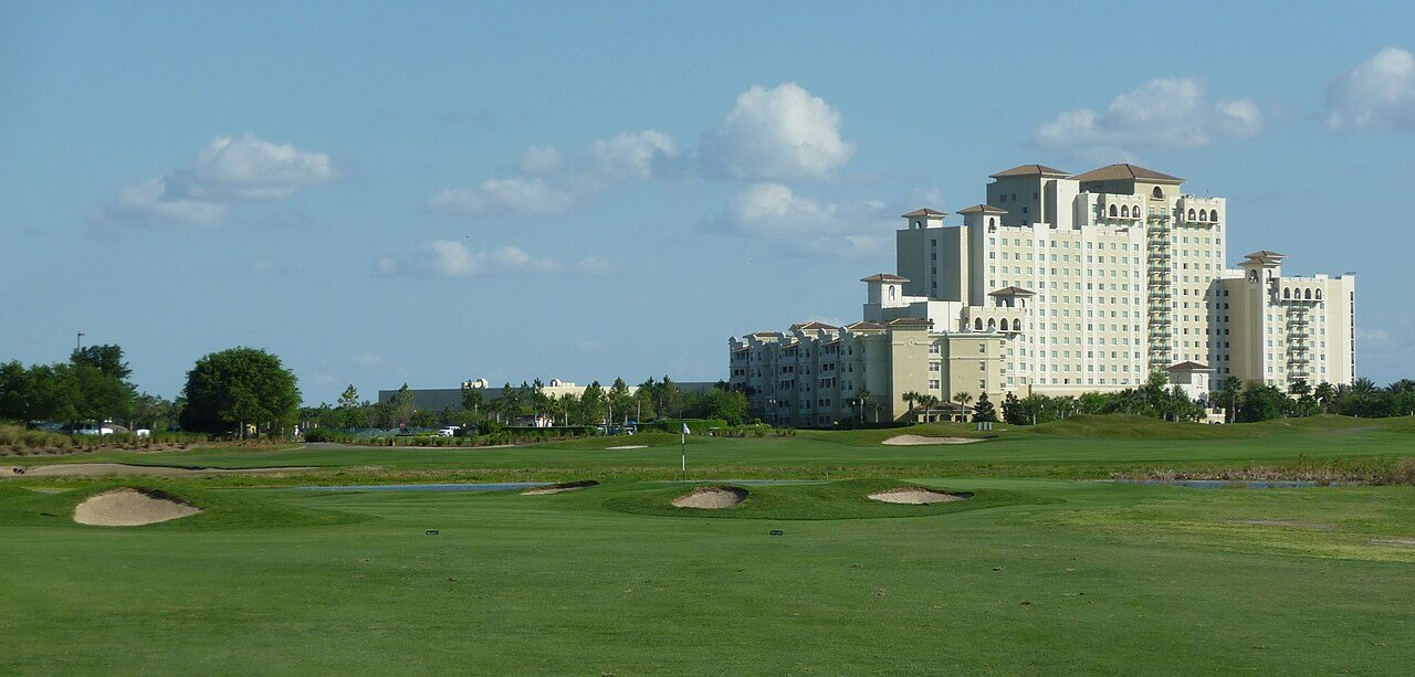 The 18th hole of the International course at ChampionsGate, with the Omni resort tower behind
