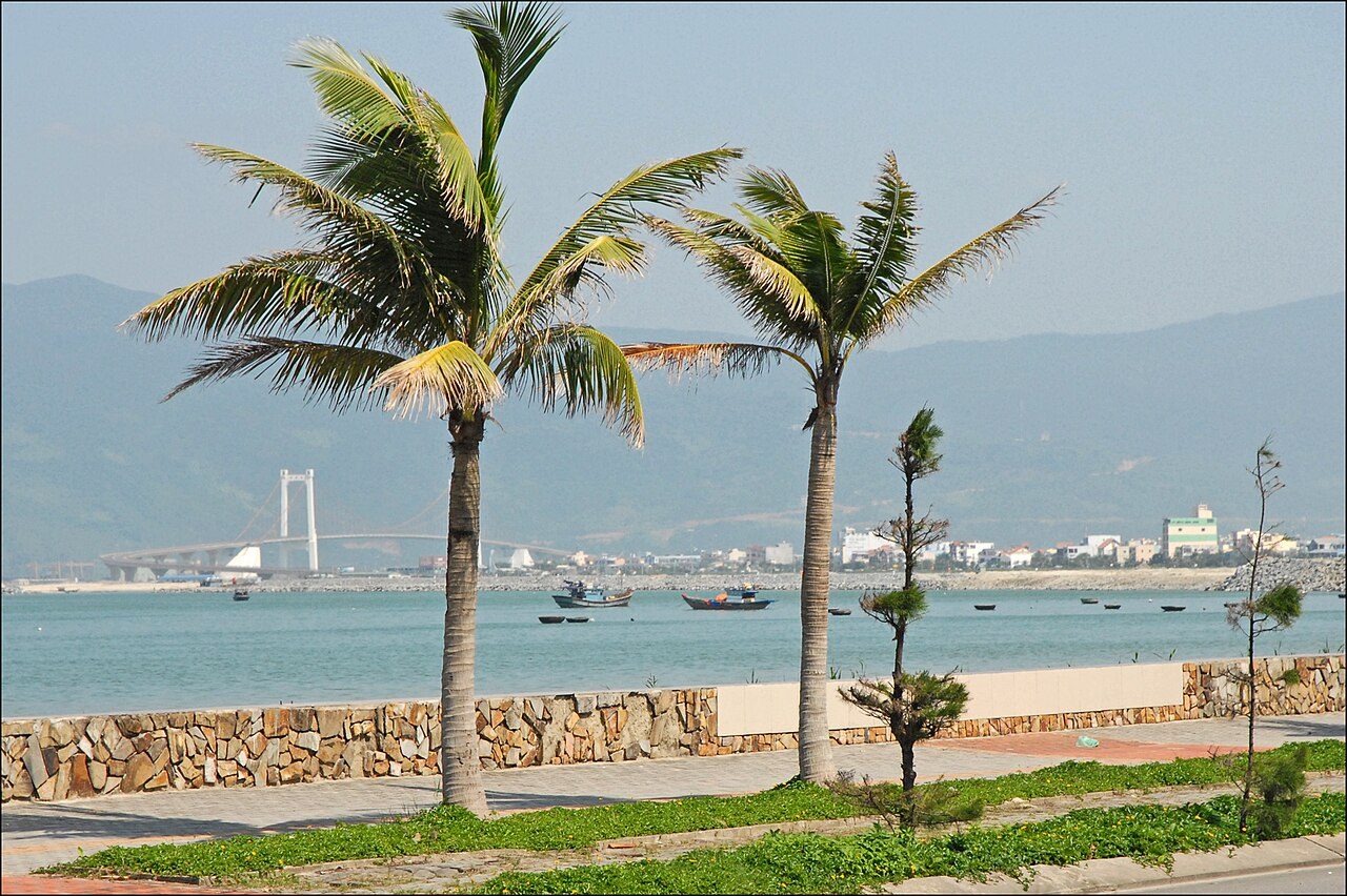 The seafront at Da Nang, the hub of Vietnam's beach golf, with palm trees and the bay
